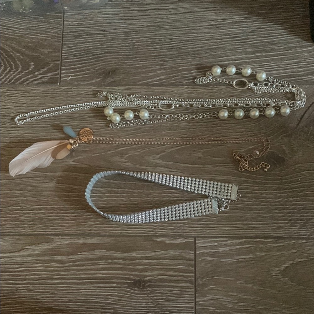 Three necklaces (pearl, feather, silver rhinestone)